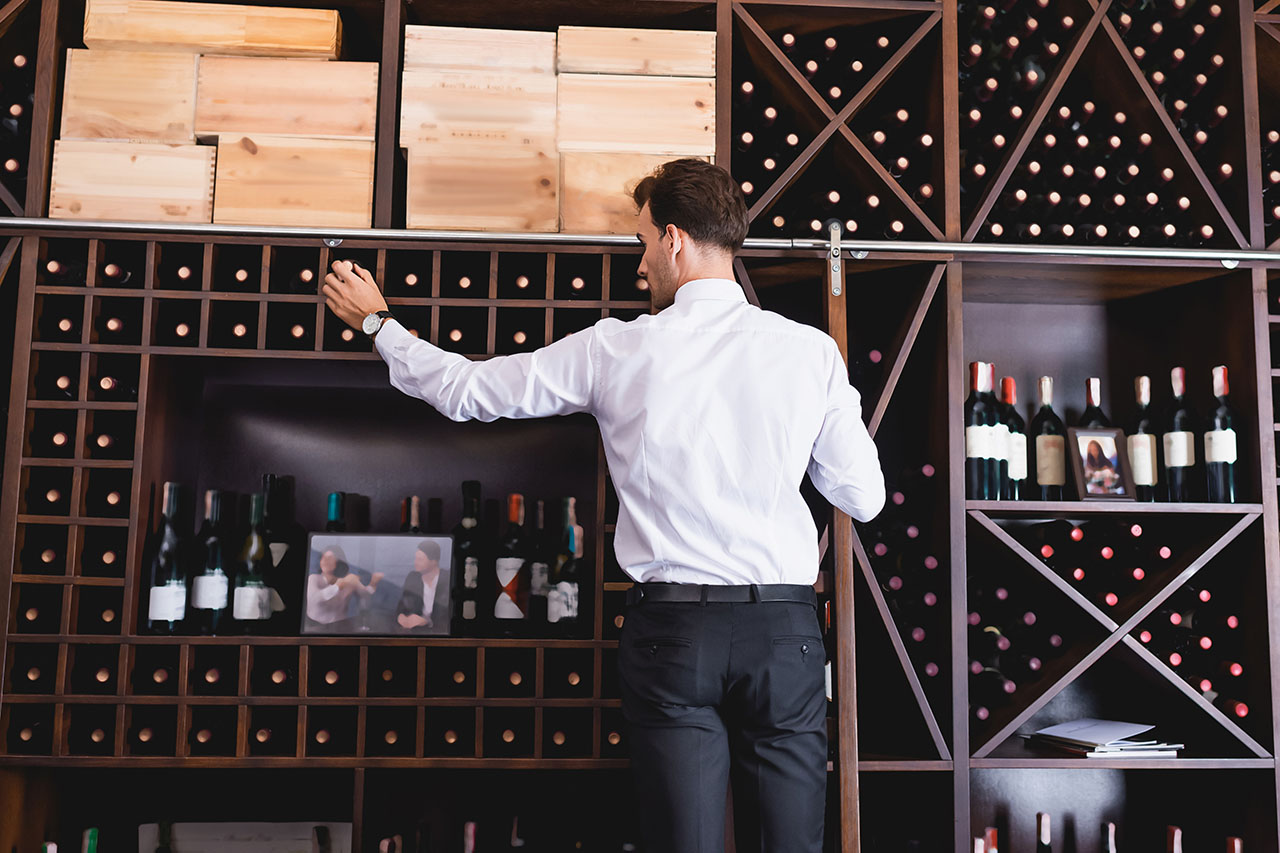 A man like Nathan Millan evaluating and appraising a wine collection. Cypress Coast Wine Group will make sure values are accurate and trustworthy.